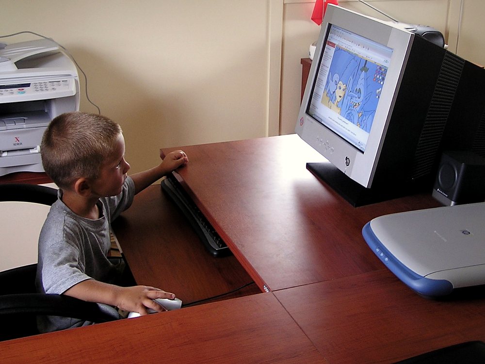 Tolga Akay as a child at a computer in the Global Nutritech office